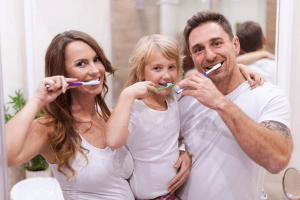 Family brushing teeth